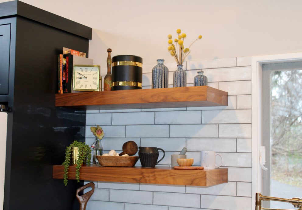 a picture of our custom modern cremation urns in a beautifully remodeled kitchen