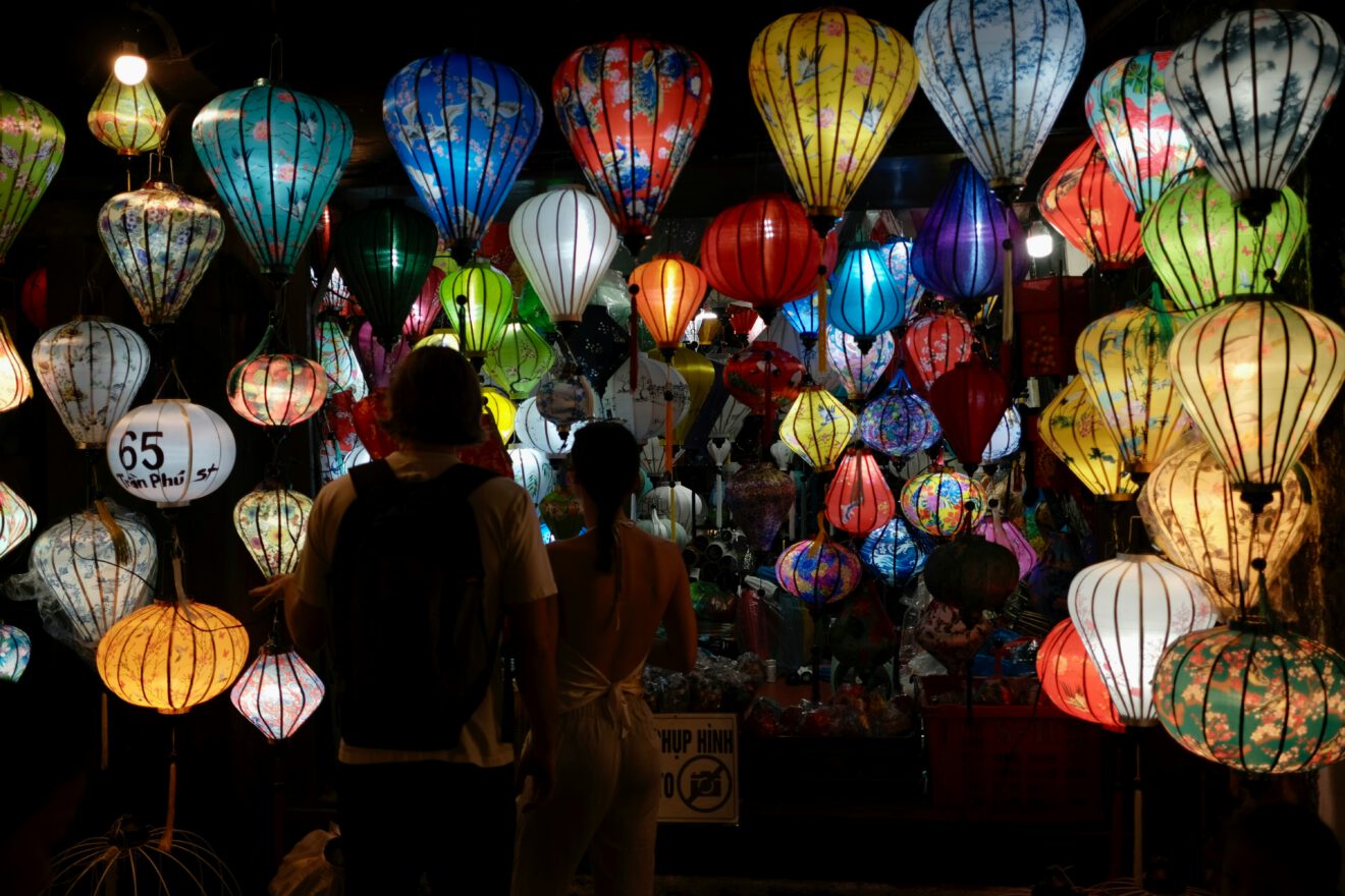 dozens of lanterns being released into the sky