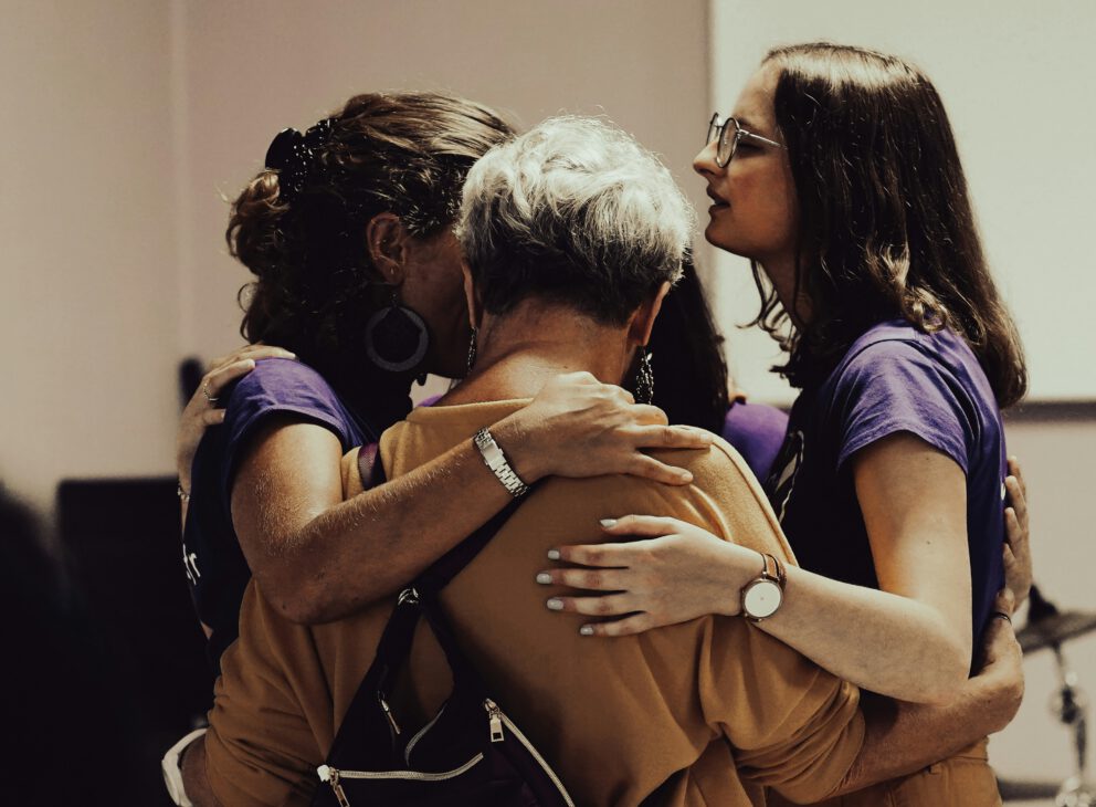 a group of women leaning on their support groups to get through grief