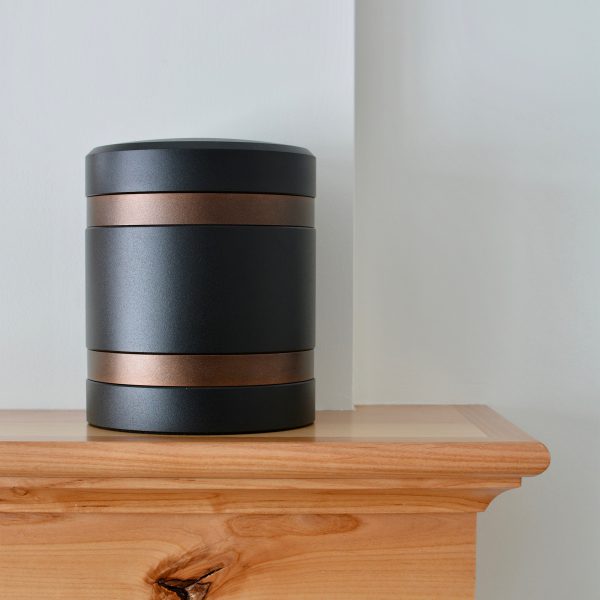 Modern Cremation Urn in black and bronze bands.